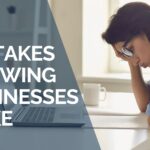 Business leader reviewing common IT mistakes growing businesses make
